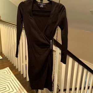 Form fitting long sleeve black dress with deep V neckline